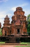 Prasat Sikhoraphum is a Khmer Hindu temple built in the 12th century by King Suryavarman II (r. 1113 - 1150).<br/><br/>

Prasat Sikhoraphum dates from the early 12th century and has been beautifully restored. It consists of five brick prangs on a square laterite platform surrounded by lily-filled ponds. The lintel and pillars of the central prang are beautifully carved with heavenly dancing girls, or apsara, and other scenes from Hindu mythology.